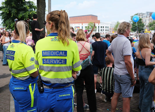 A group of people standing around each other