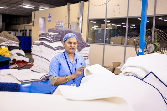 Woman works in a textile factory.
